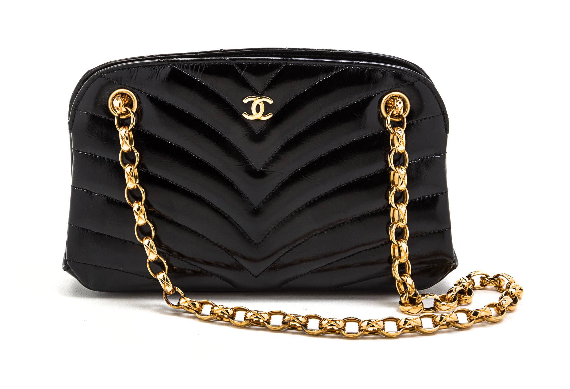 A Chanel Black Chevron Quilted Patent Leather Bag, 8 x 4 1/2 x 2 inches.