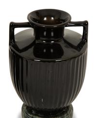 A Pair of Black Porcelain Urns on Green Marbelized Bases