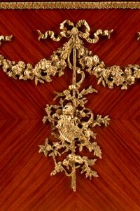 A Louis XVI Style Gilt Bronze Mounted Kingwood and Rosewood Cabinet