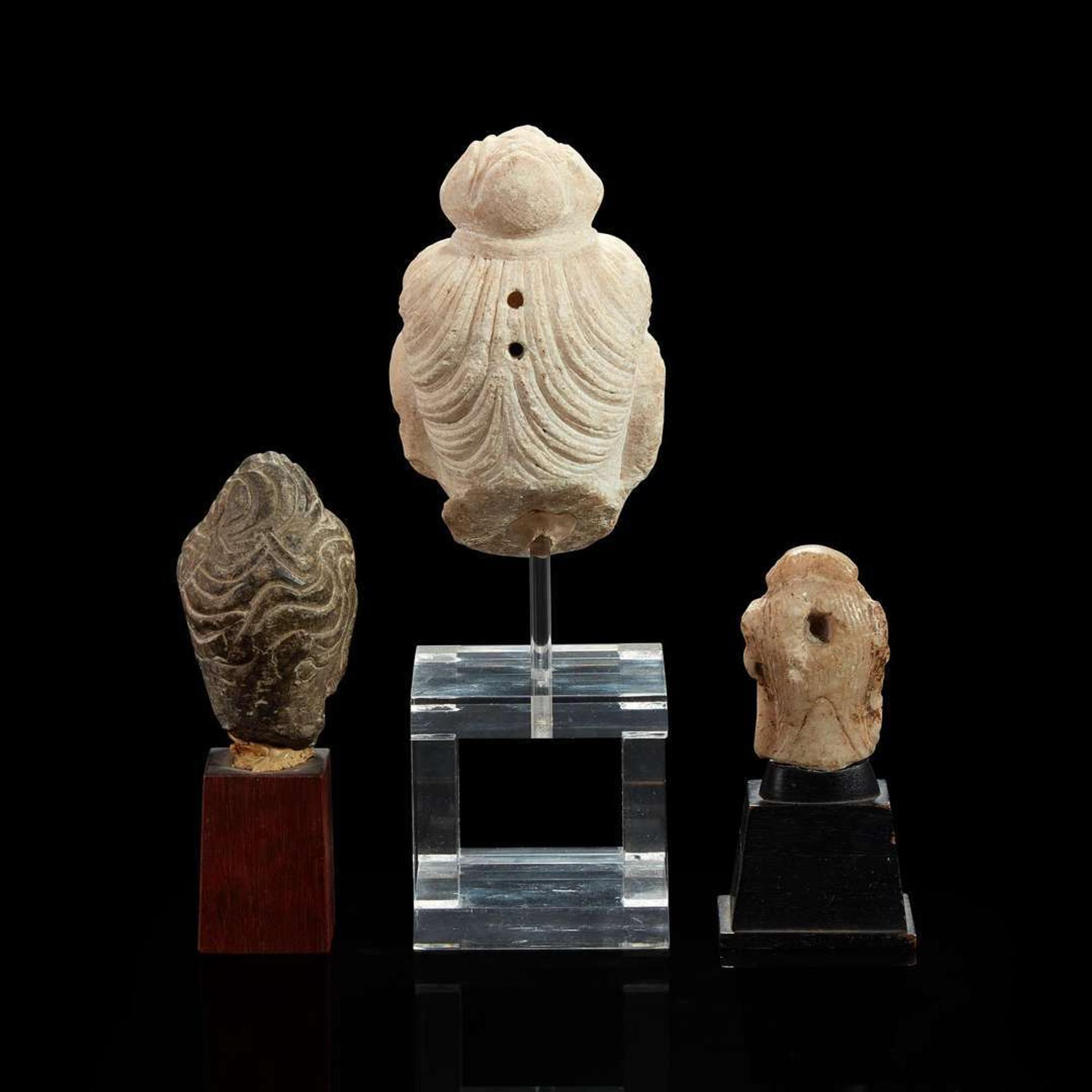 Three Chinese carved stone small heads