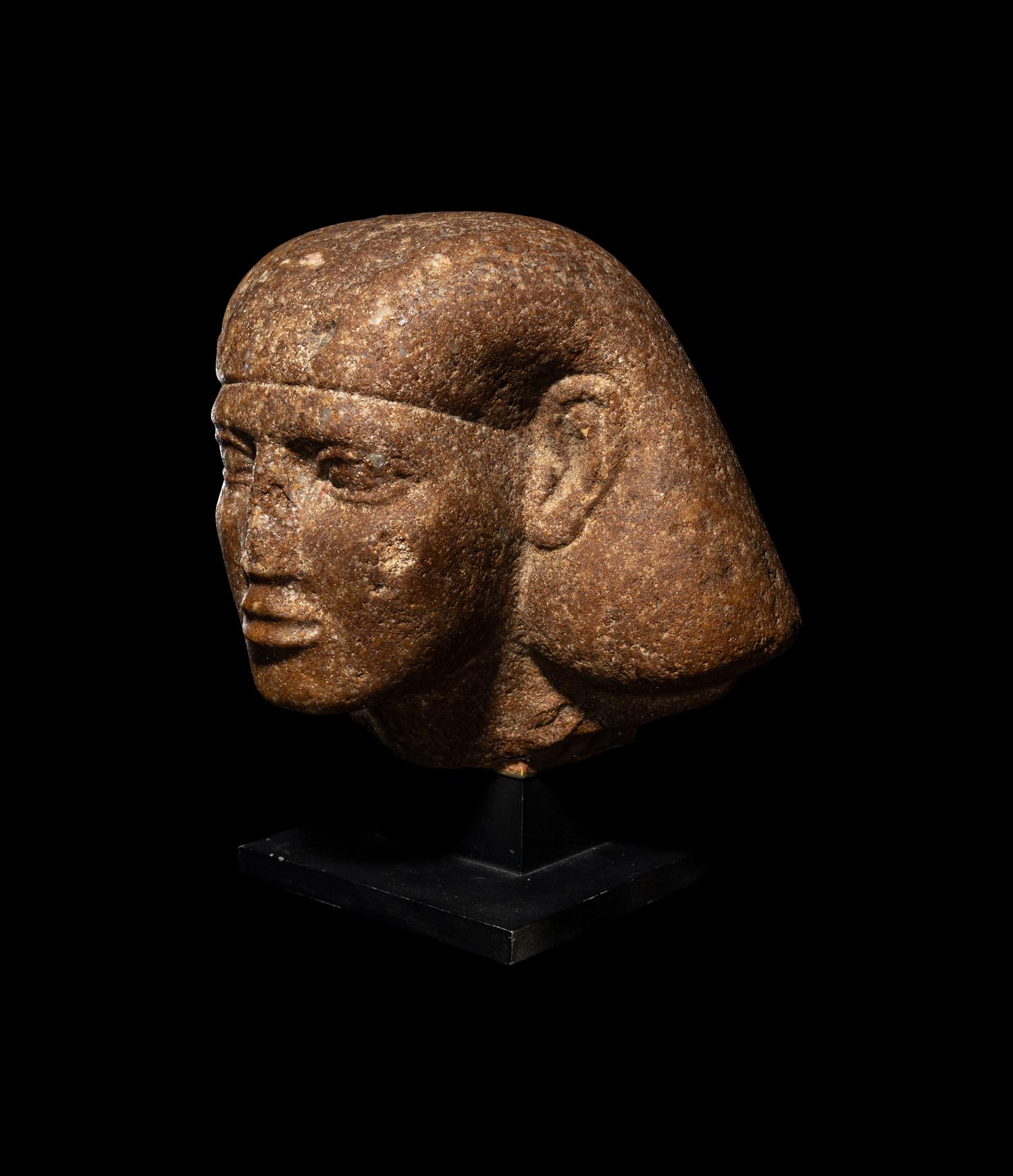 An Egyptian Granite Head of a Scribe