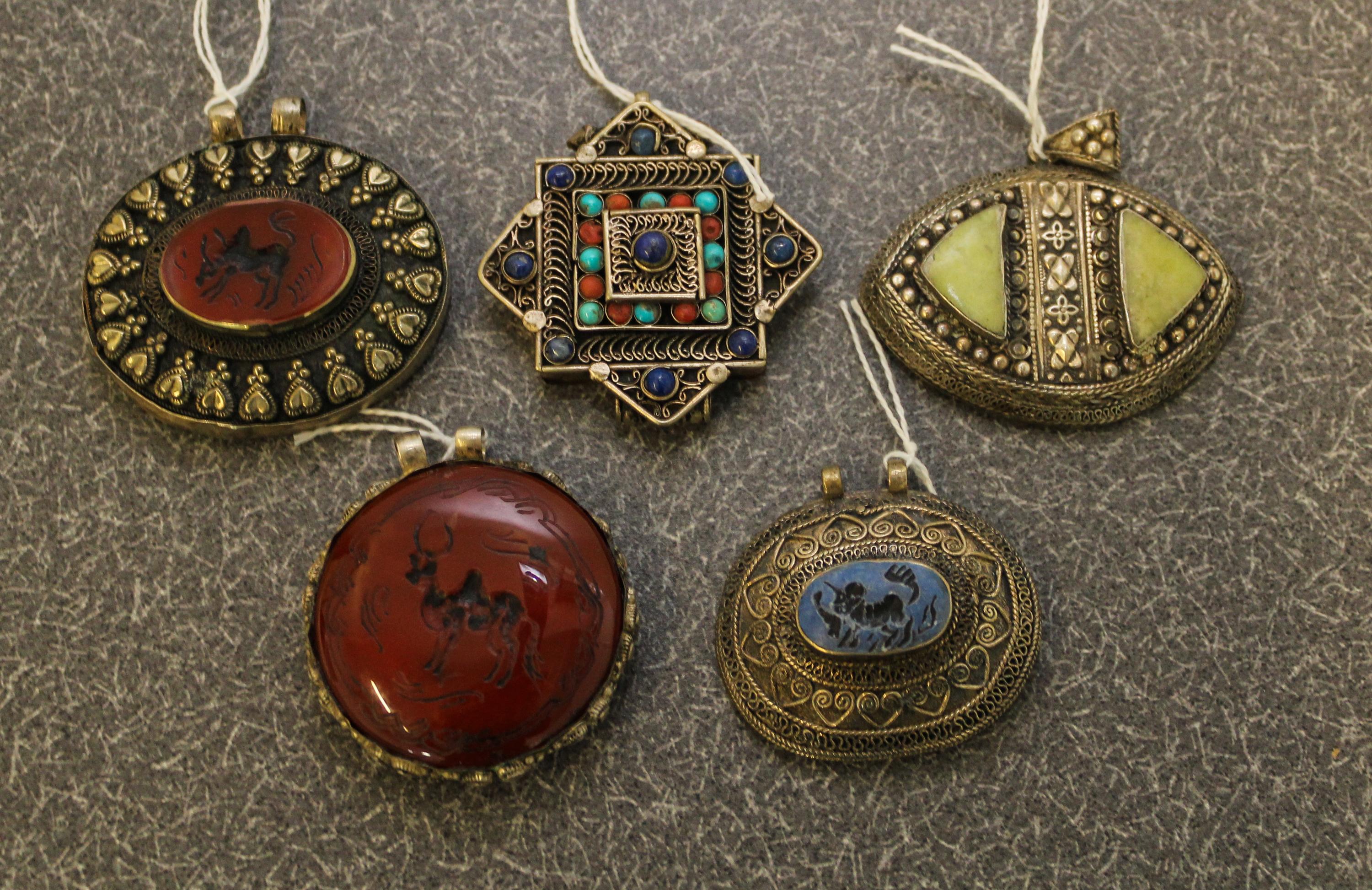 A Set of Five Asian Medallions. Width of widest 2 3/4 inches.