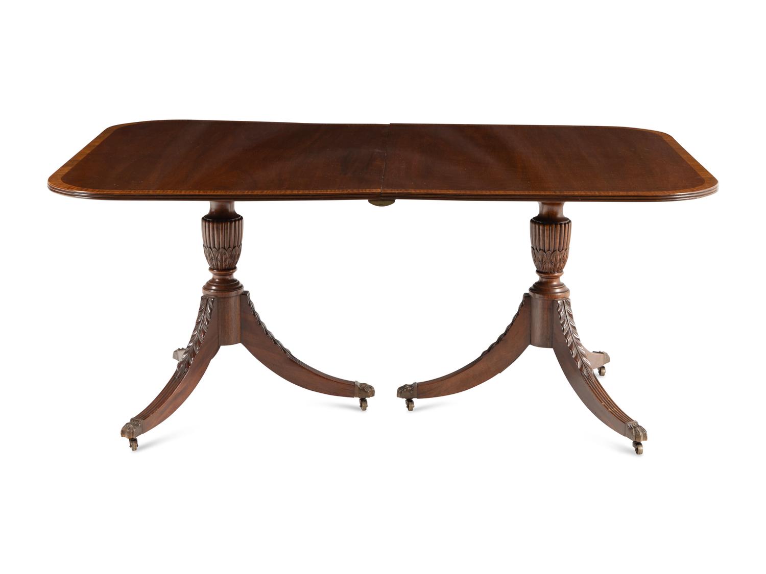 A Regency Style Mahogany and Satinwood Extension Dining Table