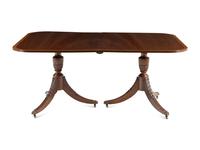 A Regency Style Mahogany and Satinwood Extension Dining Table