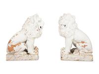 A Pair of Italian White Glazed Ceramic Seated Lions