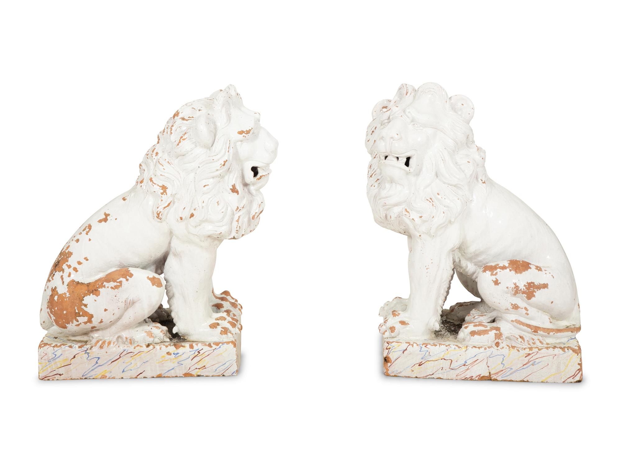 A Pair of Italian White Glazed Ceramic Seated Lions