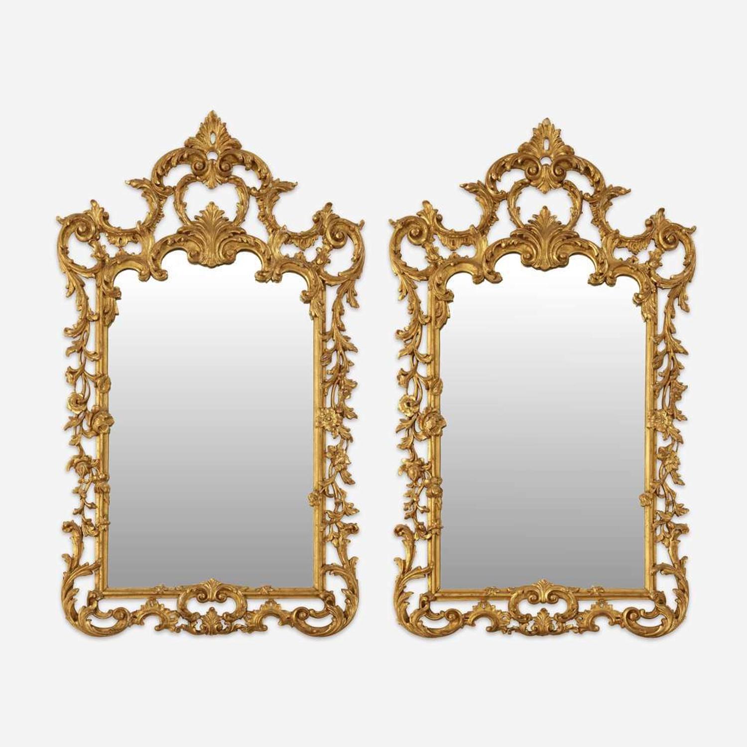 A Pair of George III Style Carved Giltwood Looking Glasses
