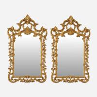 A Pair of George III Style Carved Giltwood Looking Glasses