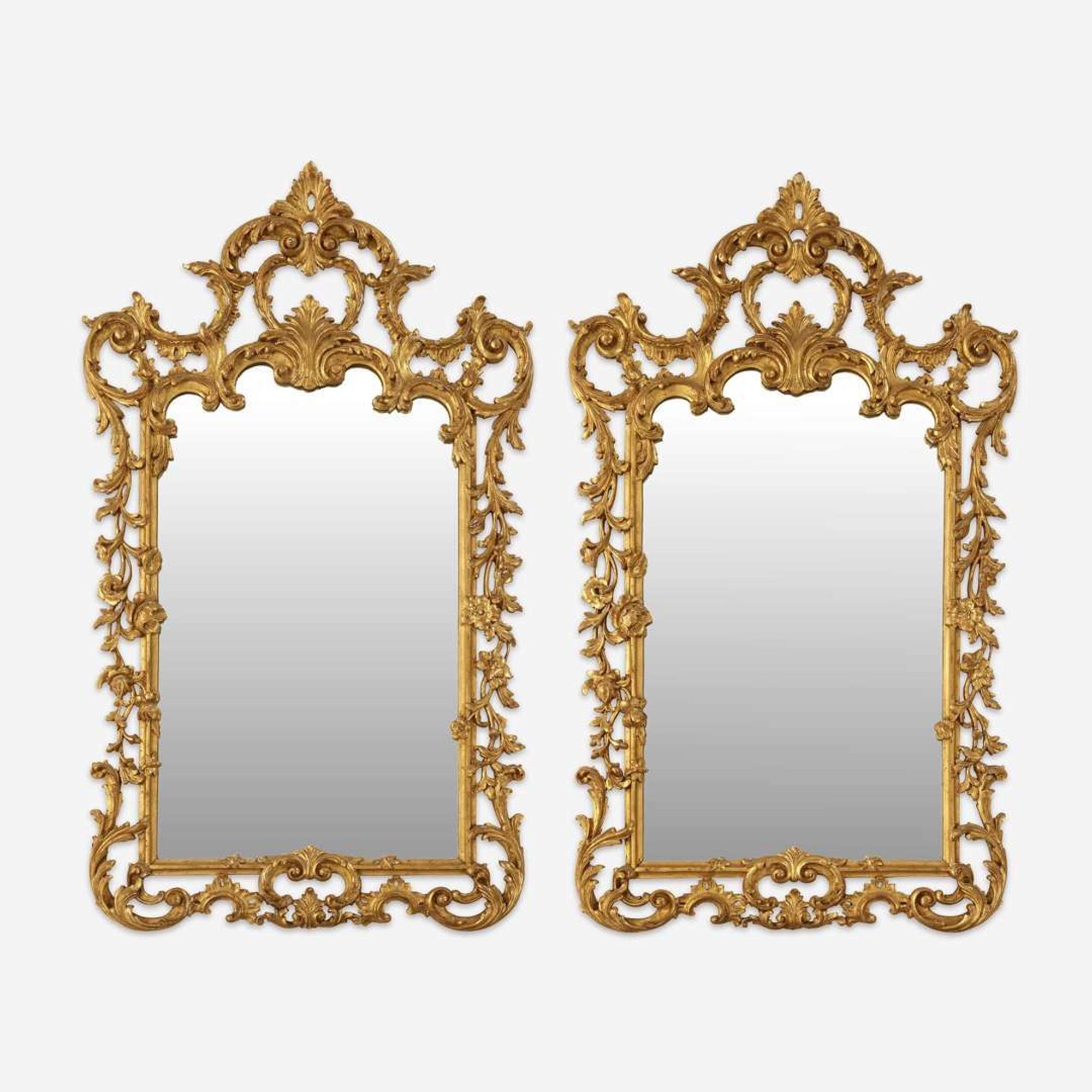 A Pair of George III Style Carved Giltwood Looking Glasses