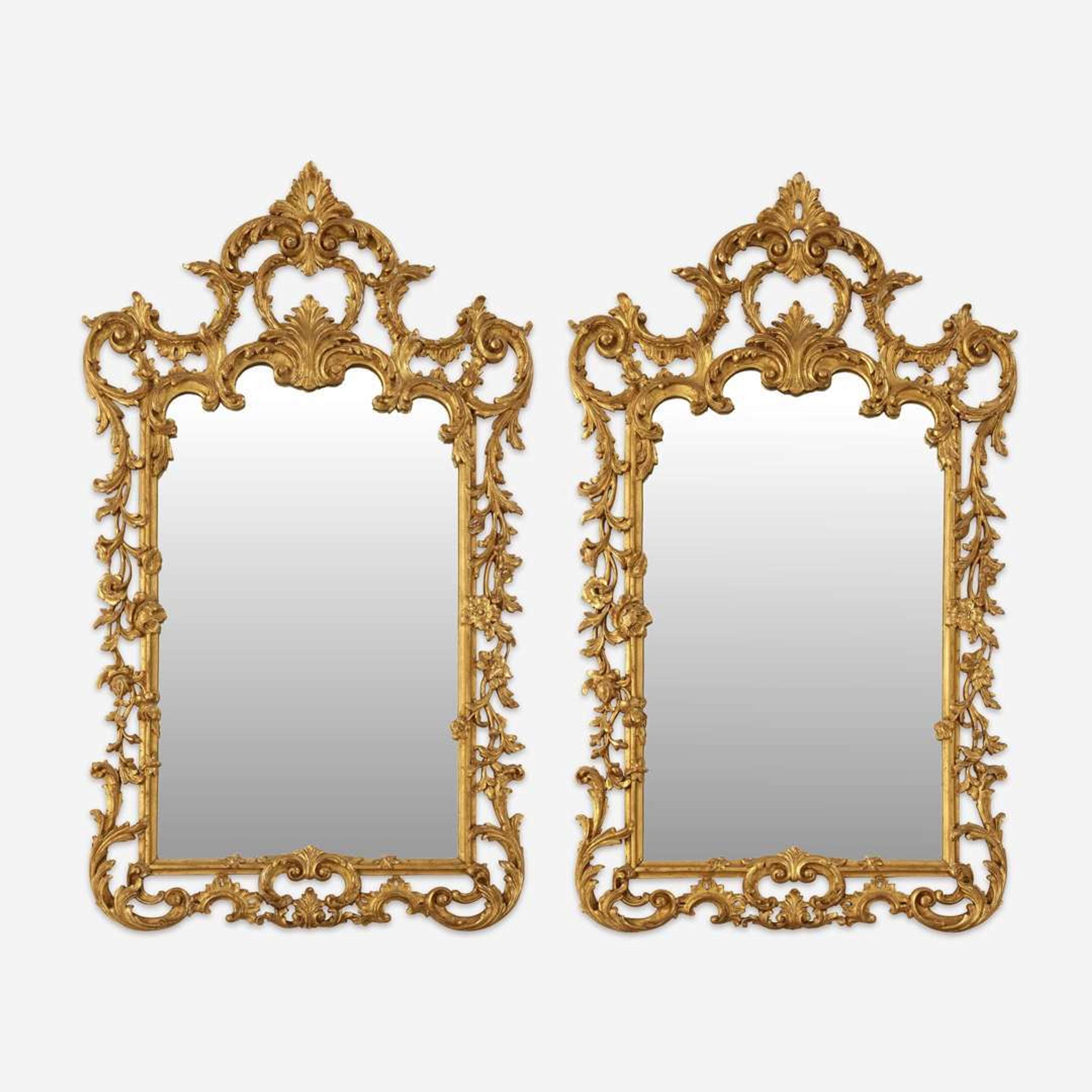 A Pair of George III Style Carved Giltwood Looking Glasses