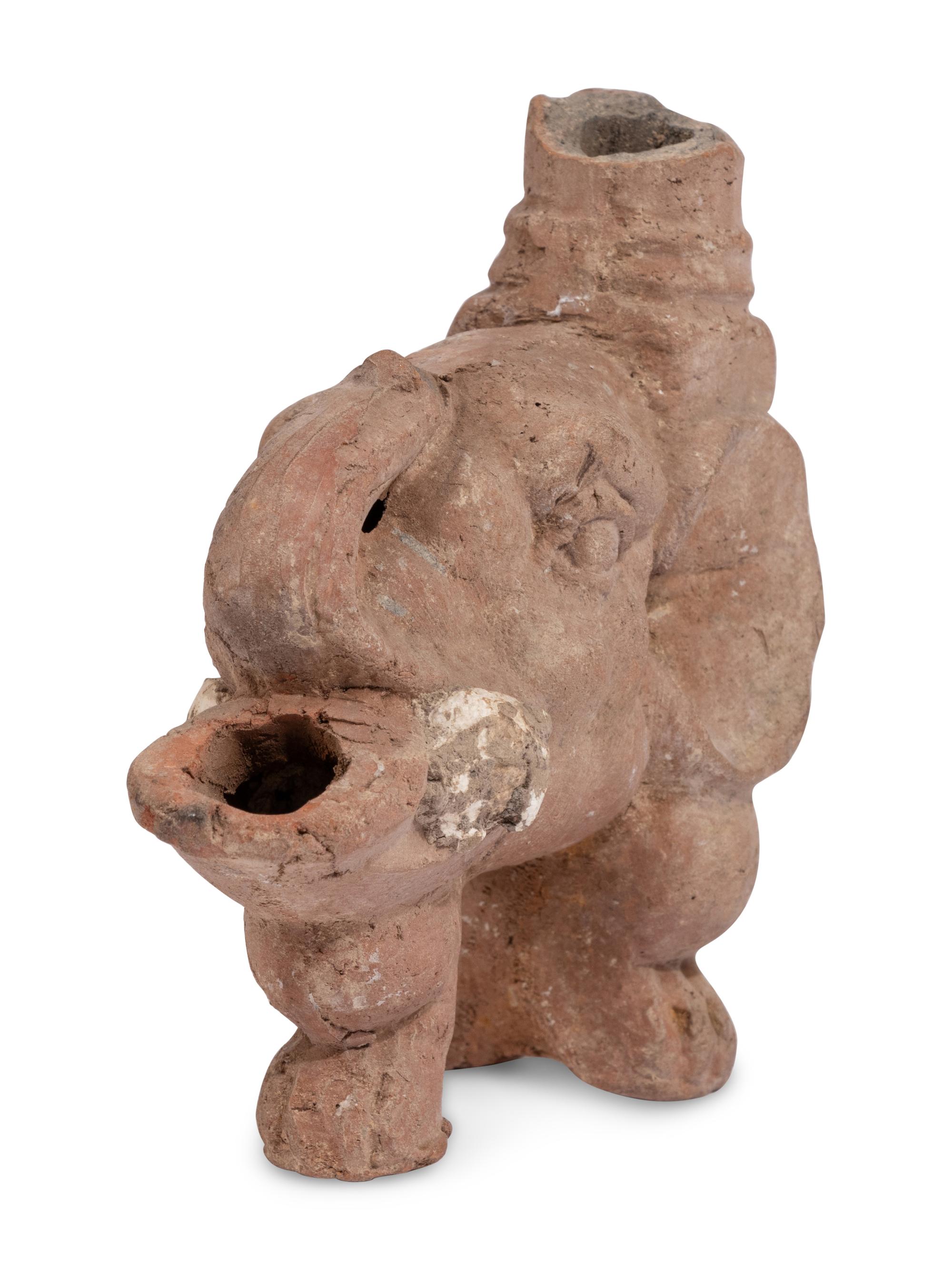 Ten Roman Terracotta Oil Lamps and a Holy Land Pottery Jug