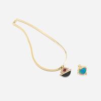 Two fourteen karat gold and gem-set enhancers with necklace