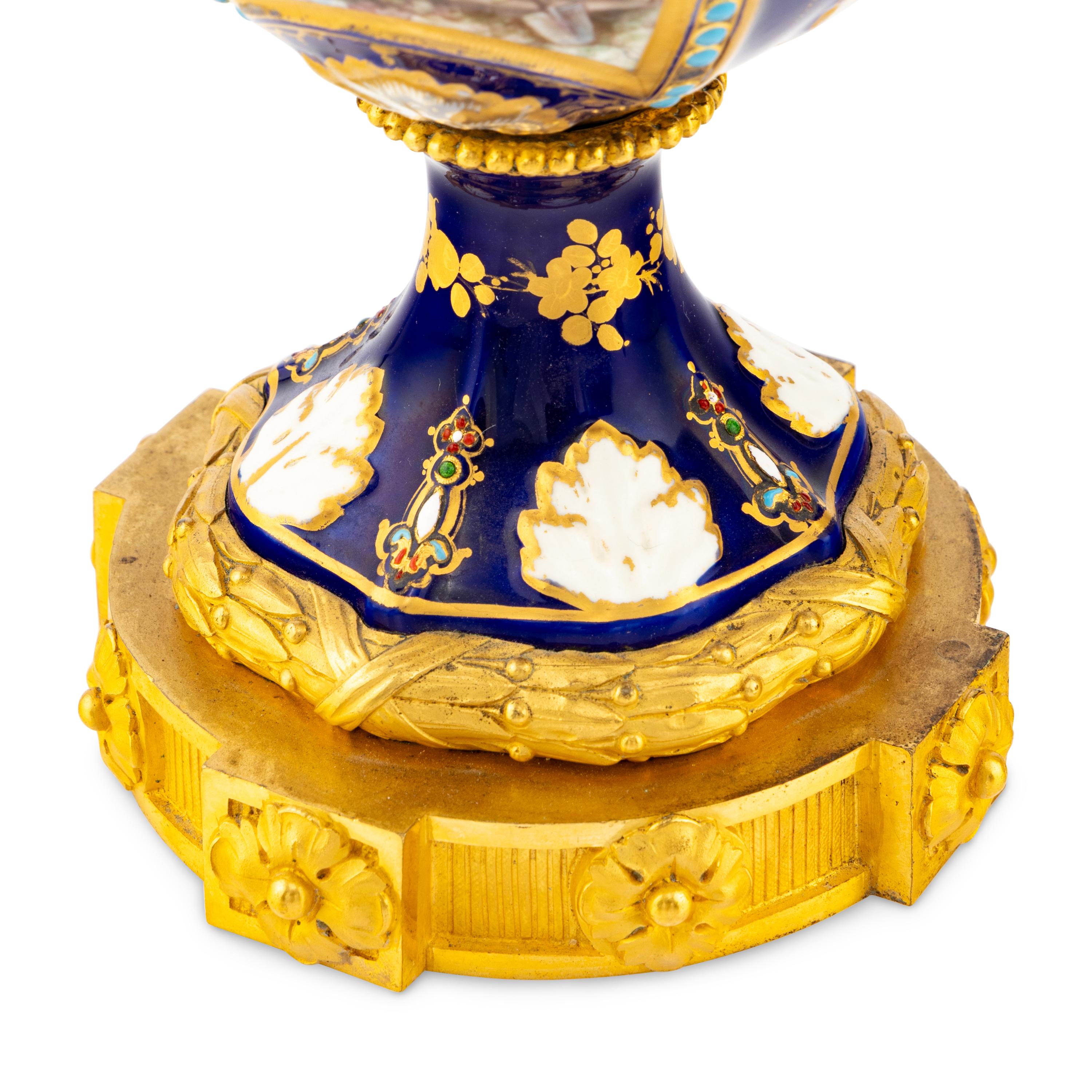 A Pair of Sèvres Style Porcelain, Enameled and Gilt Bronze Mounted Urns