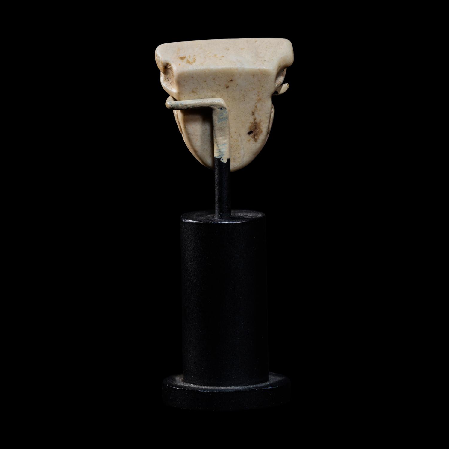 A Sumerian Limestone Face Amulet