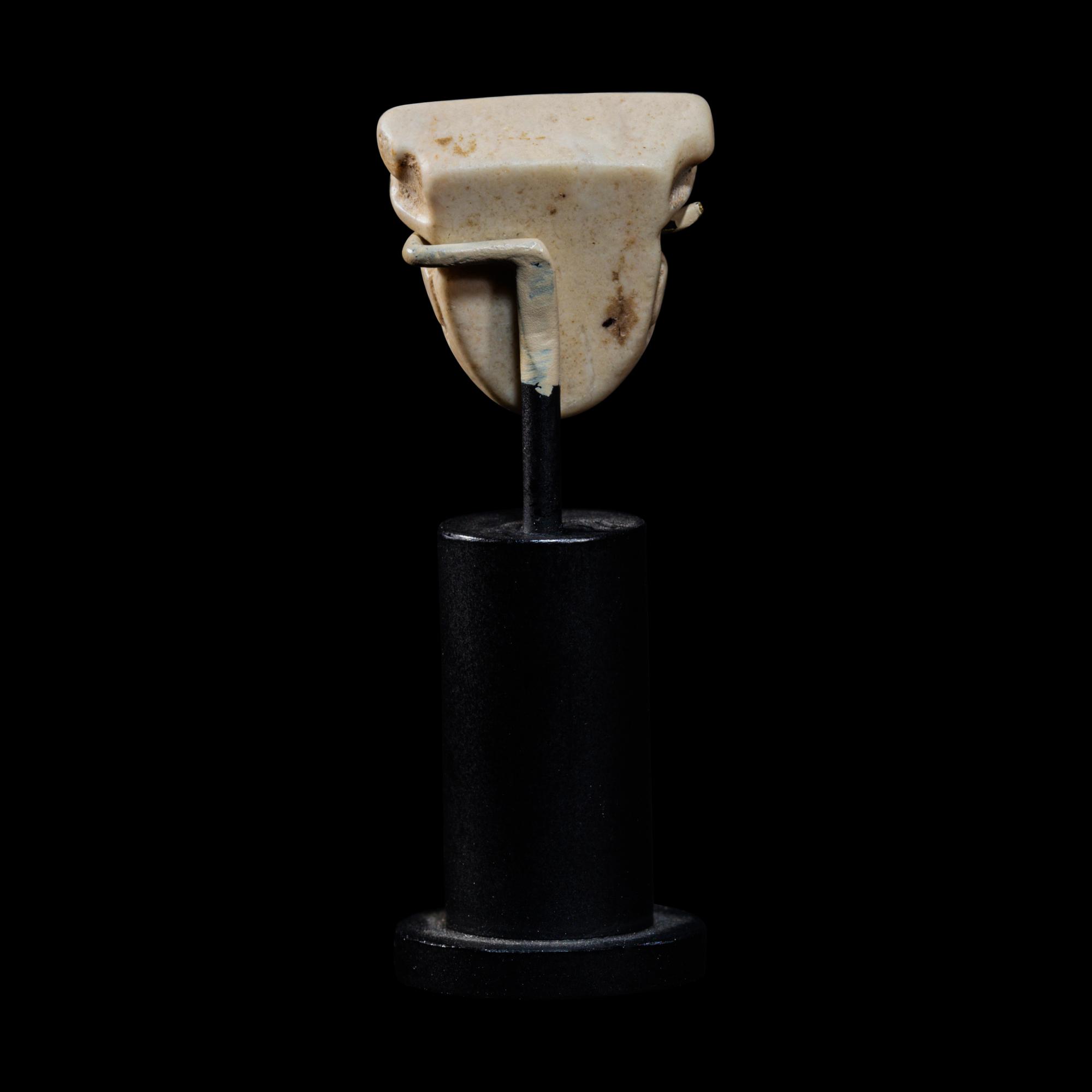 A Sumerian Limestone Face Amulet