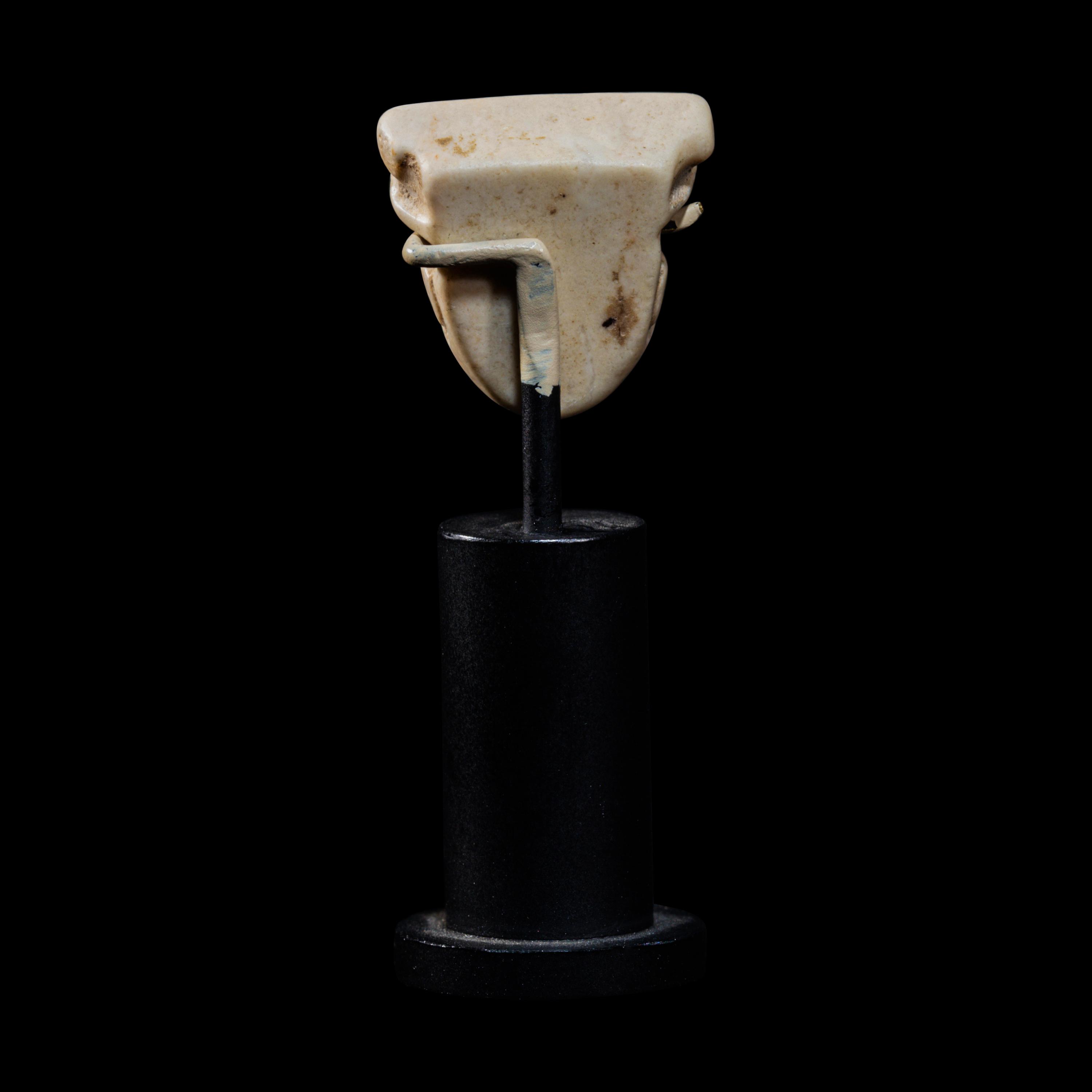 A Sumerian Limestone Face Amulet