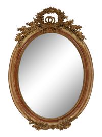 A Napoleon III Giltwood Oval Mirror