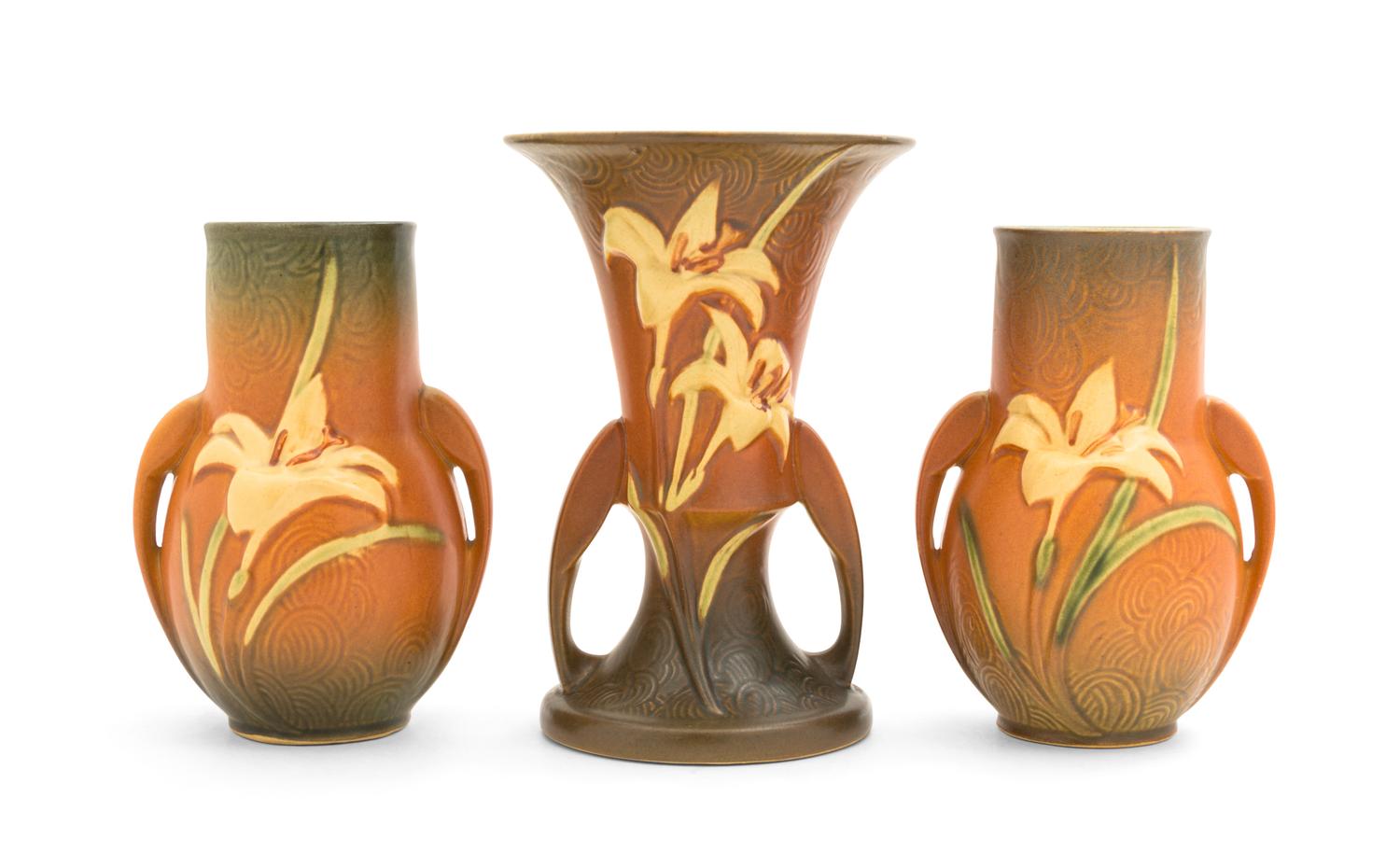 Three Roseville Zephyr Lily Pottery Vases Height of first 7 1/4 inches, pair 6 1/4 inches.