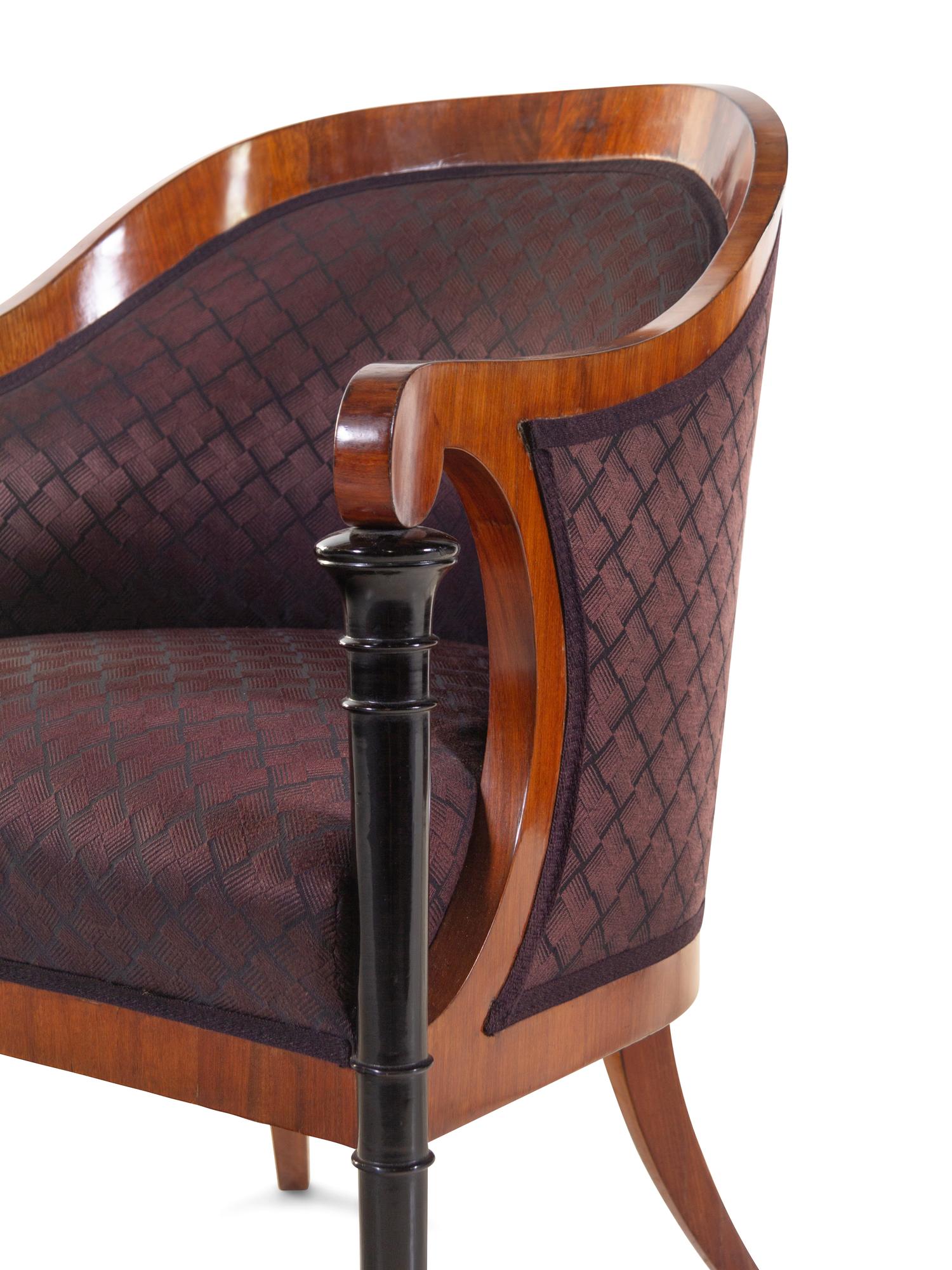 A Set of Four Biedermeier Mahogany Veneered and Parcel Ebonized Armchairs
