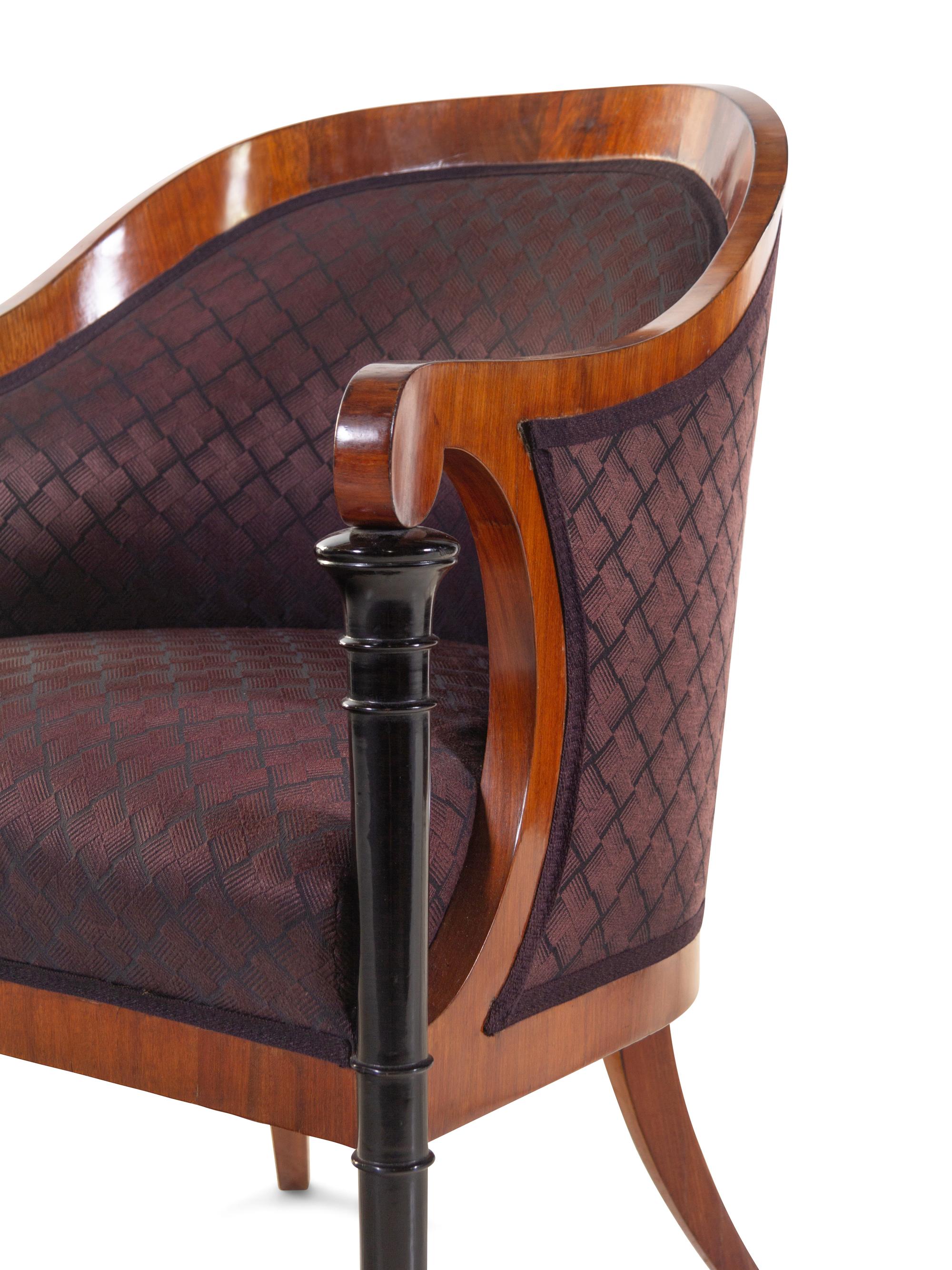 A Set of Four Biedermeier Mahogany Veneered and Parcel Ebonized Armchairs