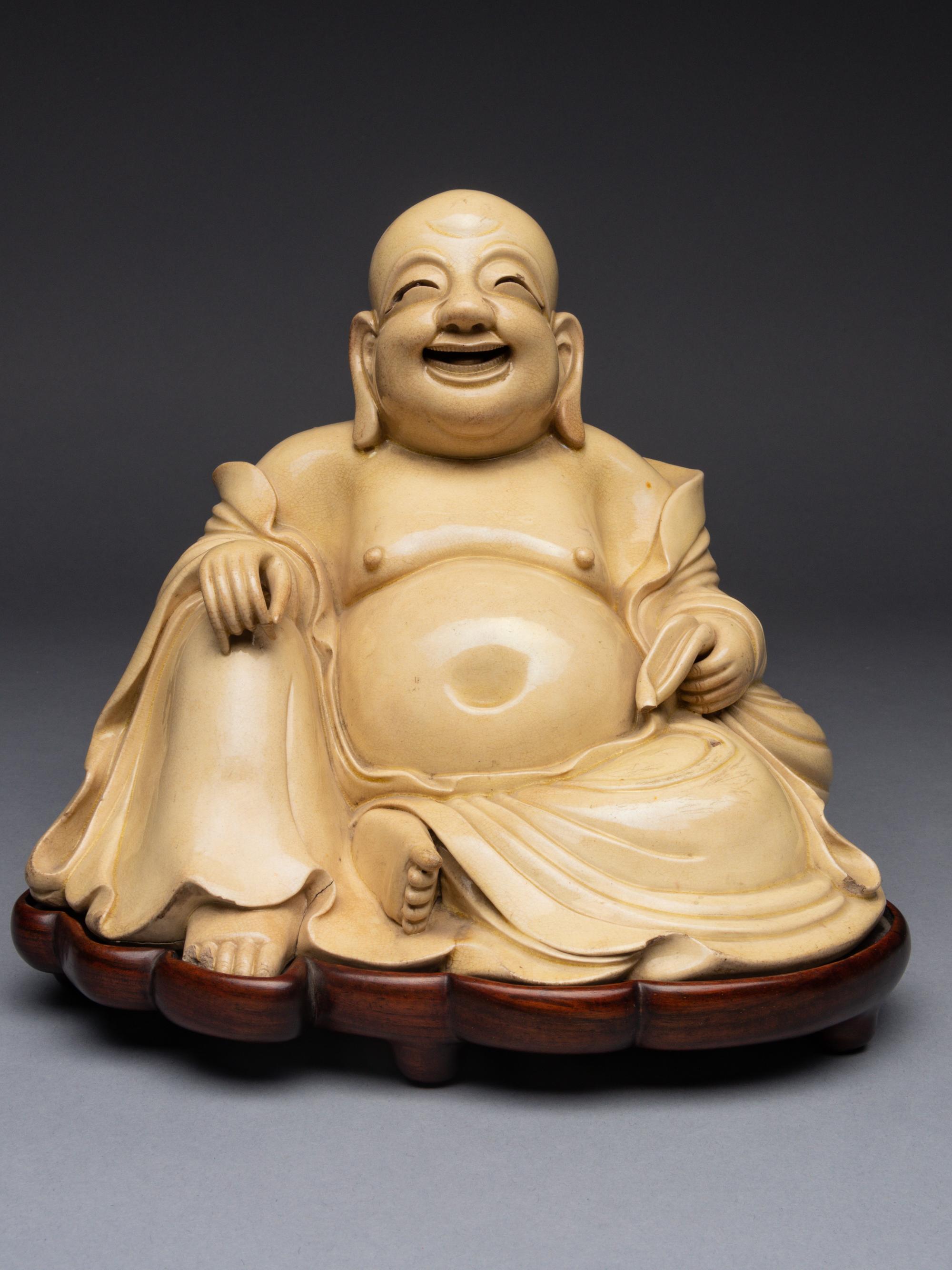 A White Glazed Figure of Budai Buddha