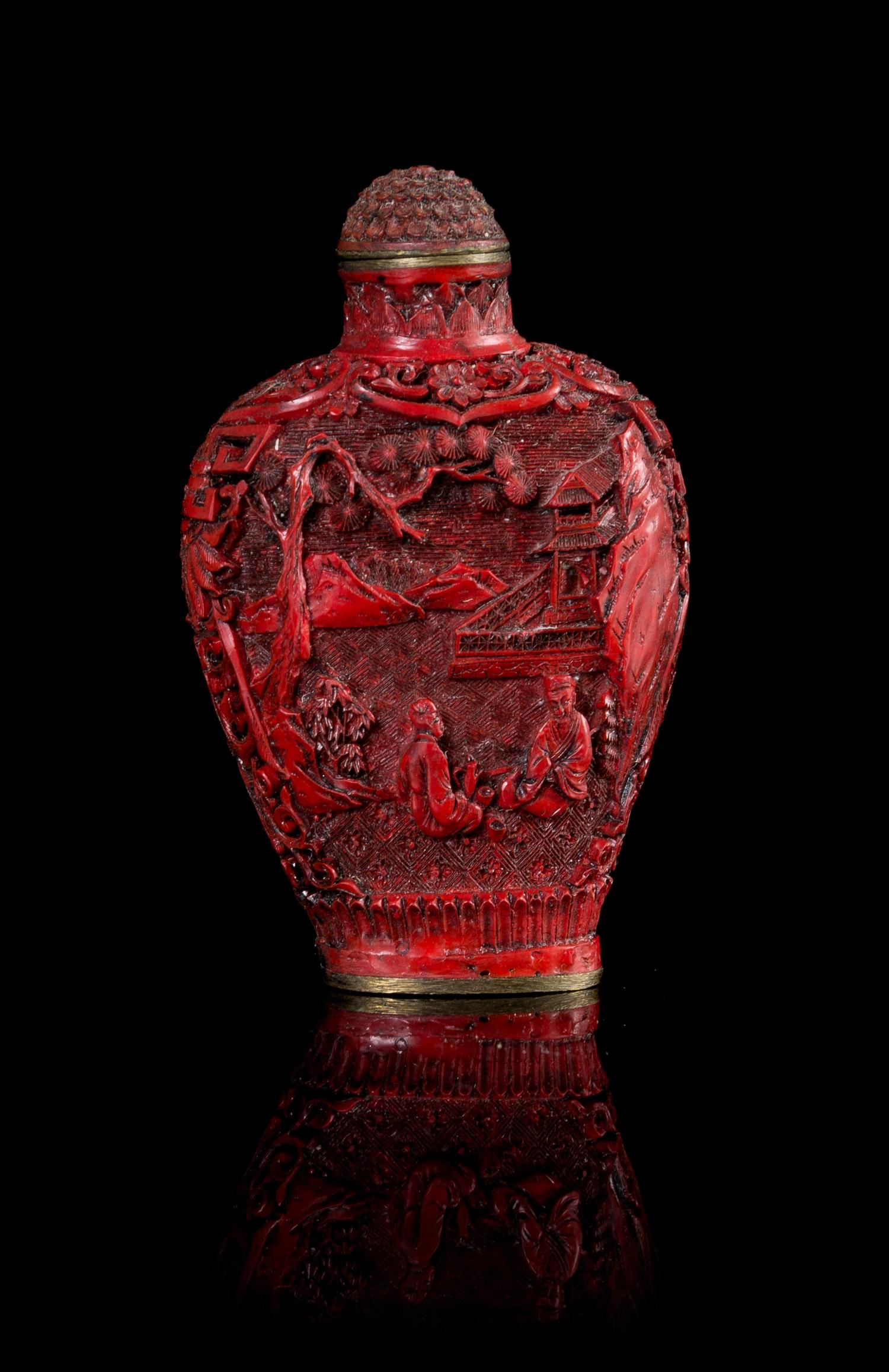 A Cinnabar Lacquer Snuff Bottle Height 2 3/4 inches.