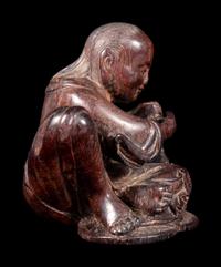 A Carved Zitan Wood Figural Group of Liu Hai and Three-Legged Toad