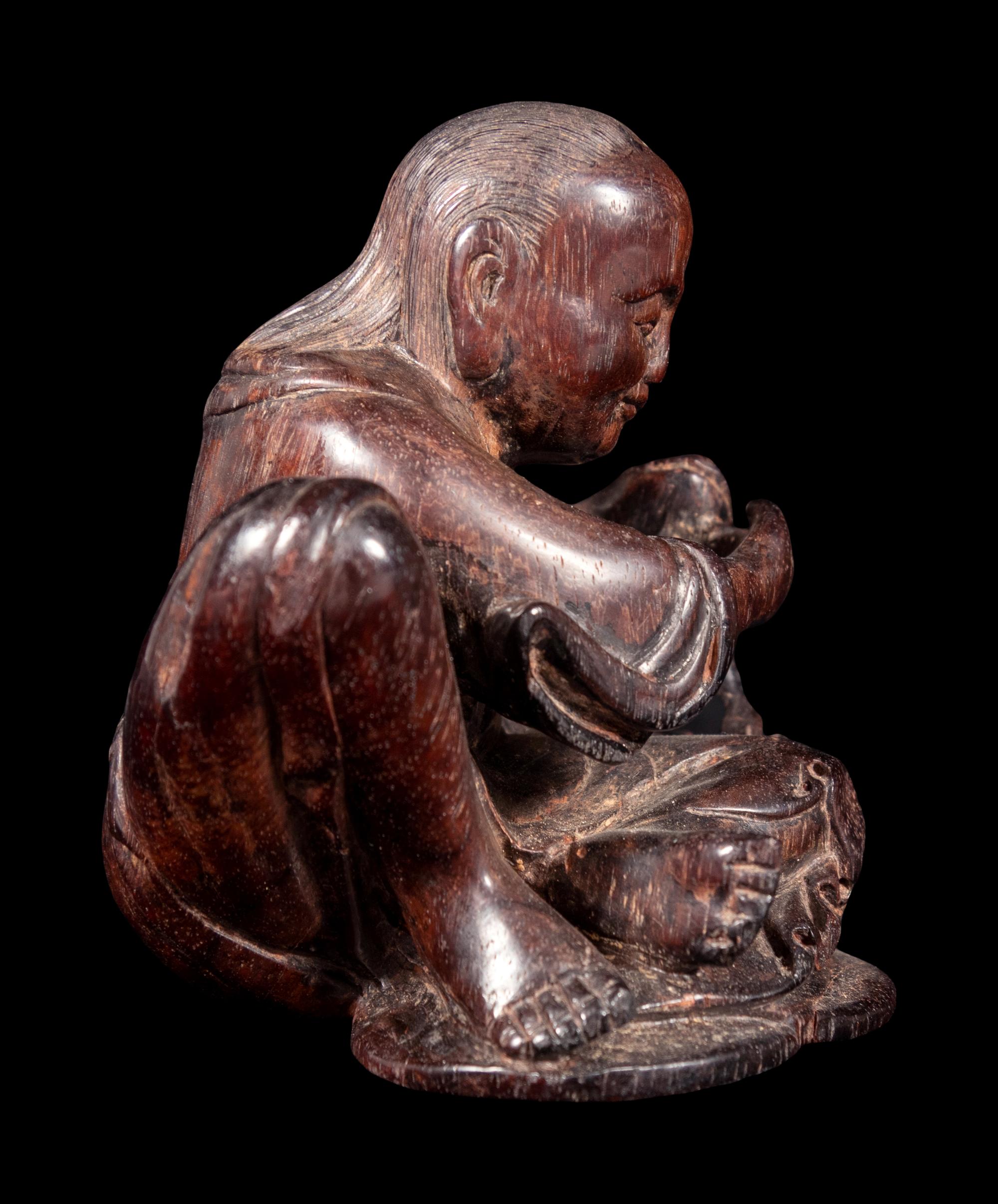 A Carved Zitan Wood Figural Group of Liu Hai and Three-Legged Toad