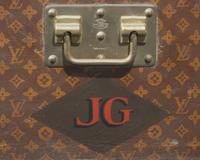 A Louis Vuitton Monogrammed Canvas Hardsided Trunk with 'JG' Monogram