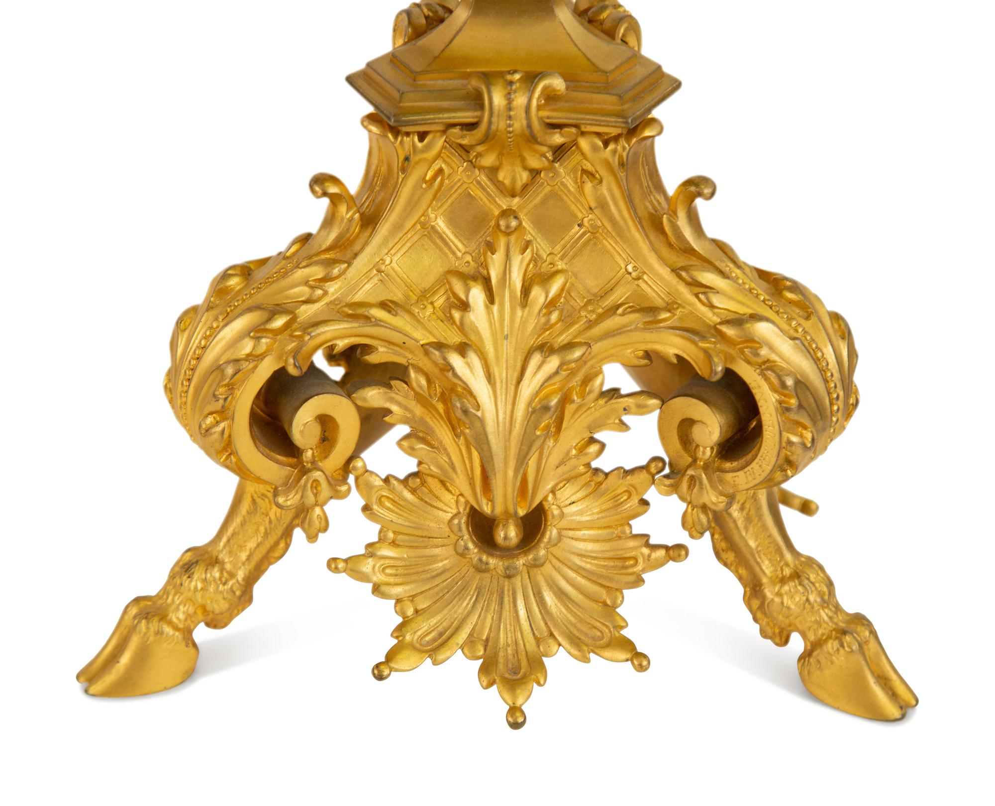 A Pair of Gilt Bronze Figural Seven-Light Candelabra