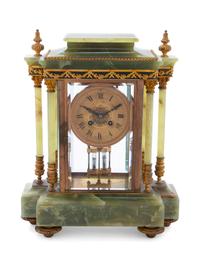 A French Gilt Bronze Mounted Onyx Mantel Clock