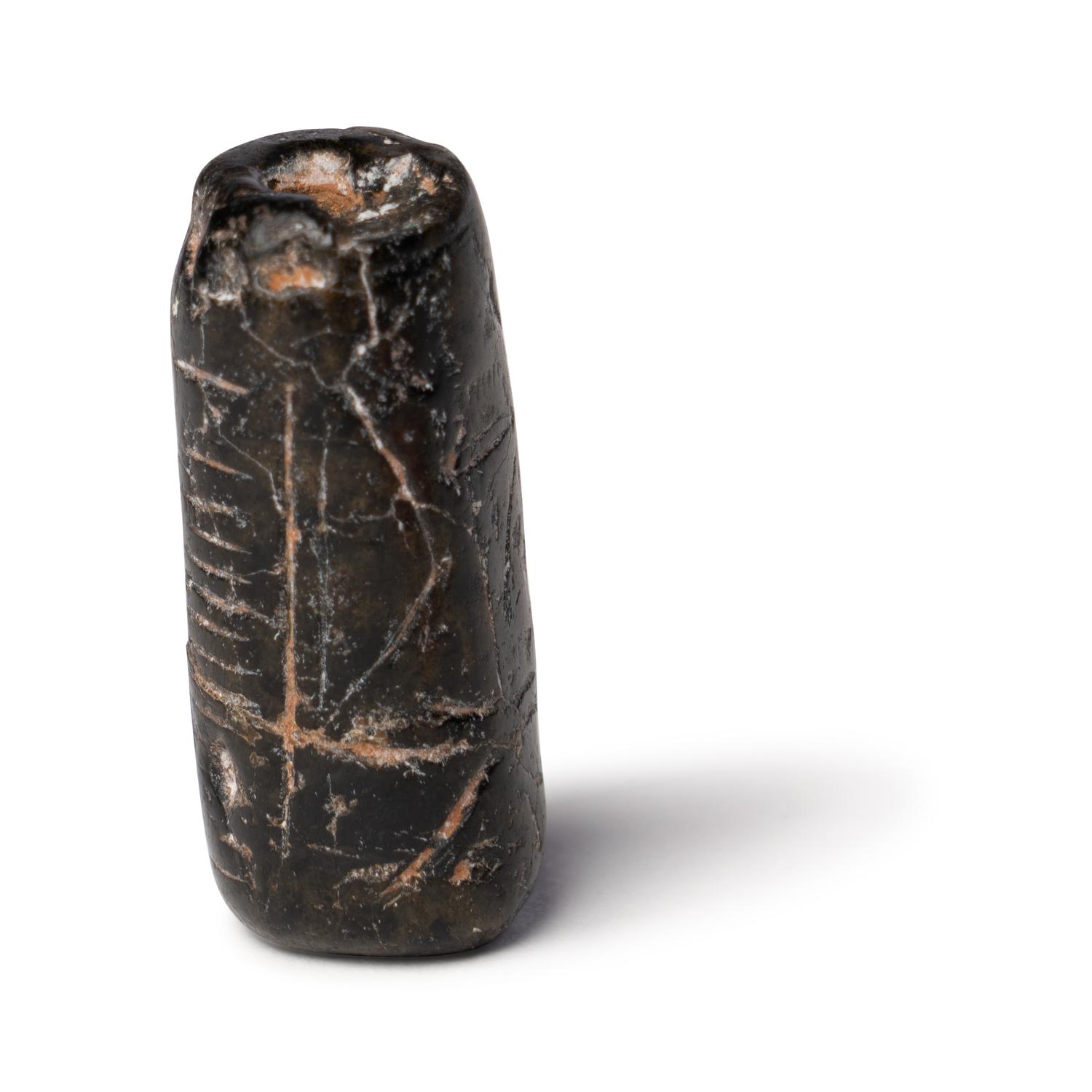 A Mesopotamian Black Steatite Cylinder Seal