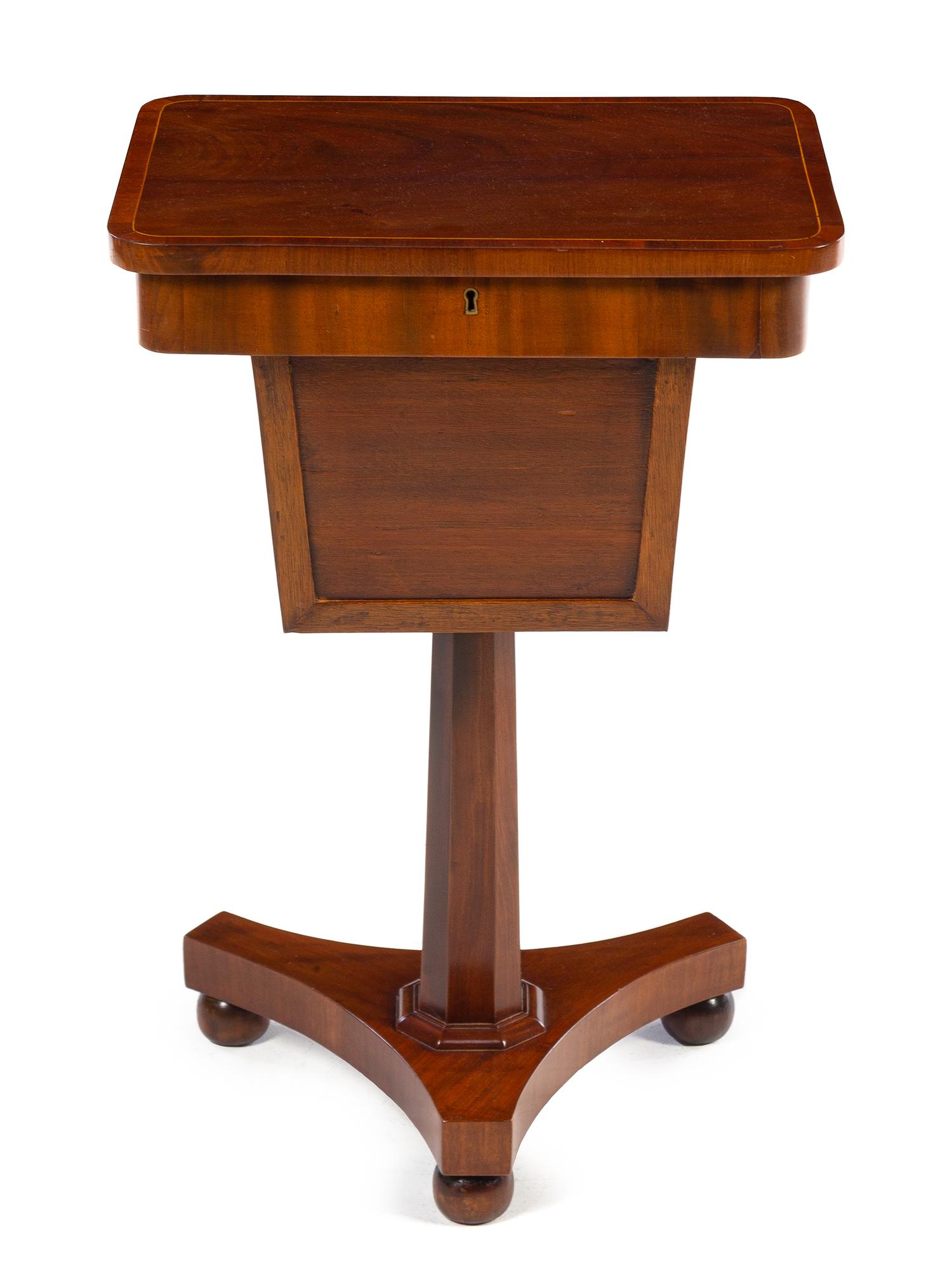 A Regency Style Mahogany Tea Poy Height 28 inches. — 19TH CENTURY