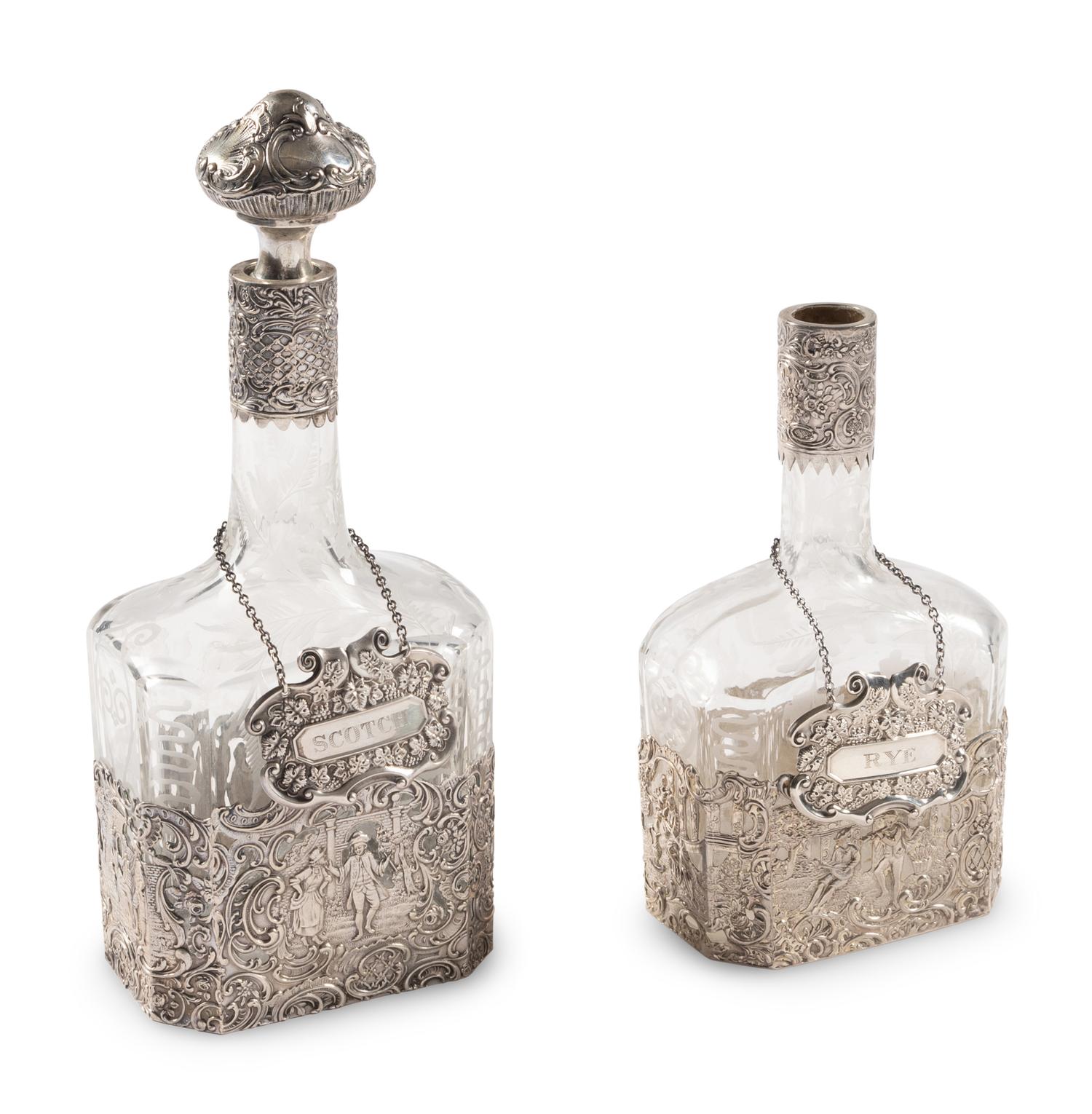 Two Silver Mounted Etched Glass Decanters
