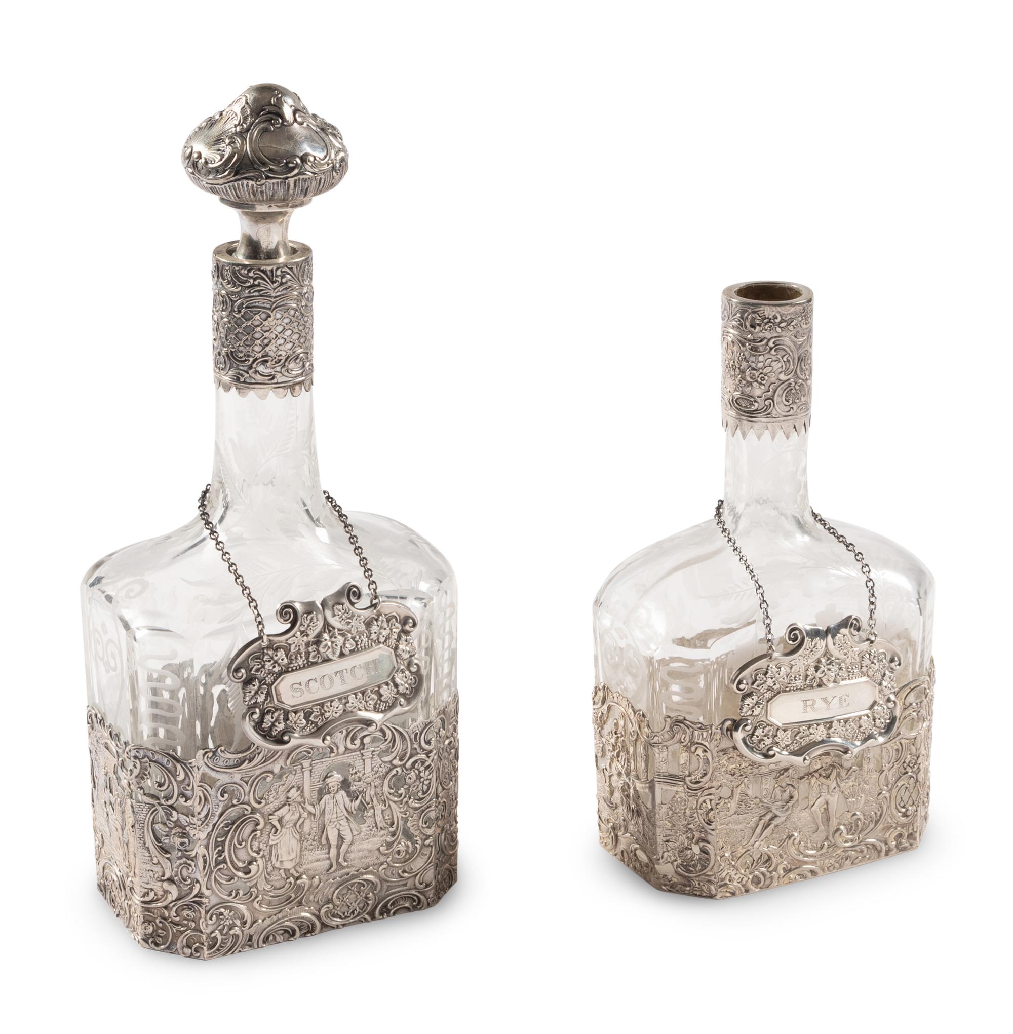 Two Silver Mounted Etched Glass Decanters