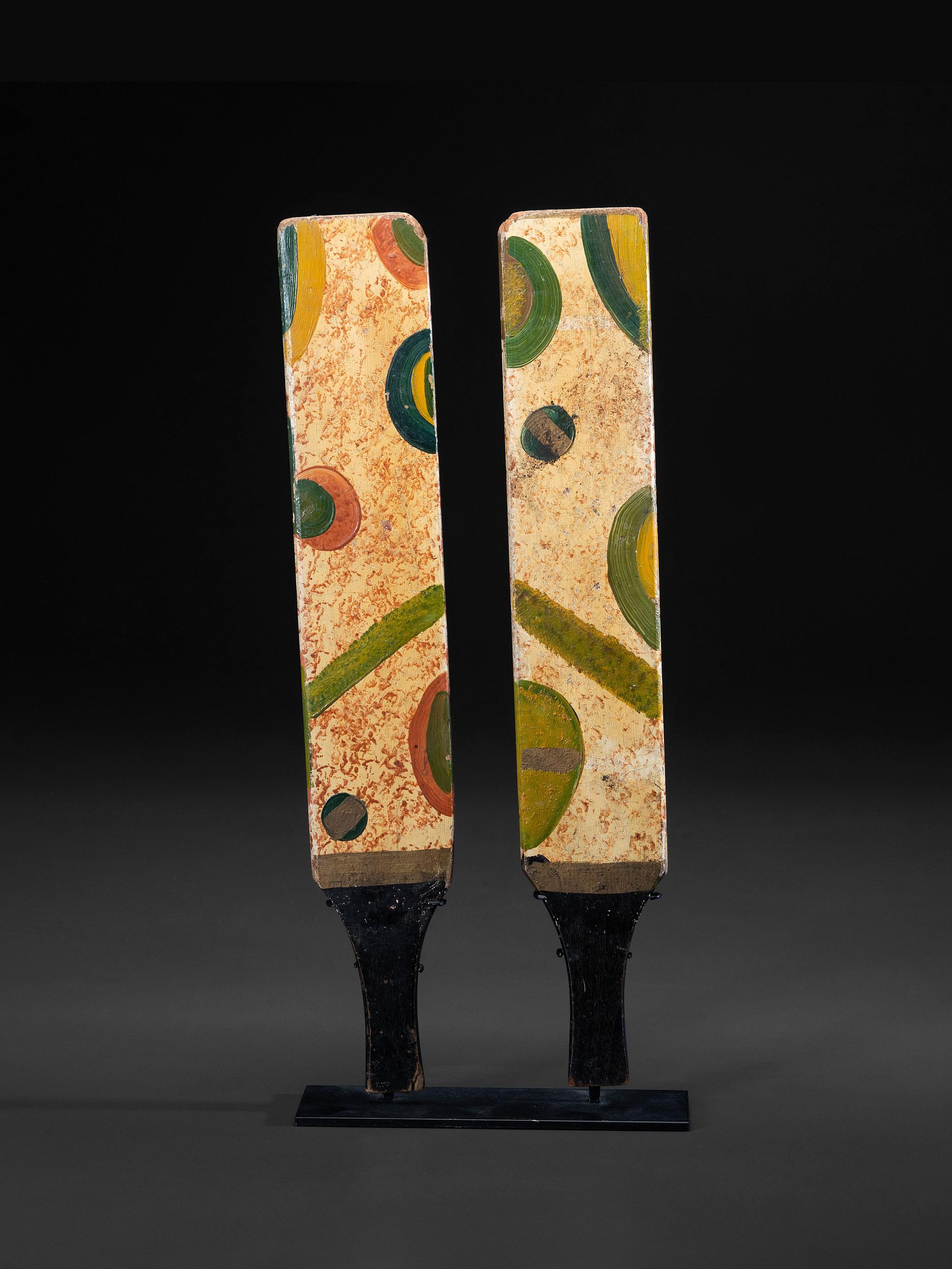 A Pair of Paint Decorated Game Paddles