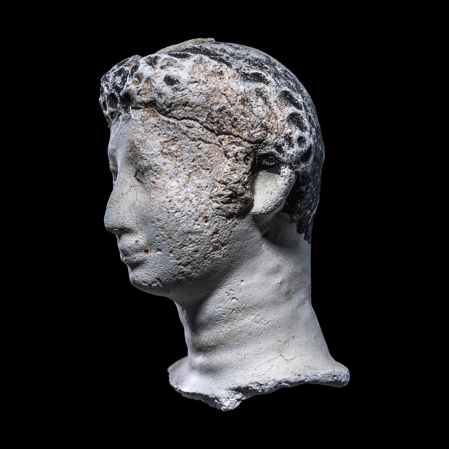 An Egyptian Painted Stucco Mummy Mask
