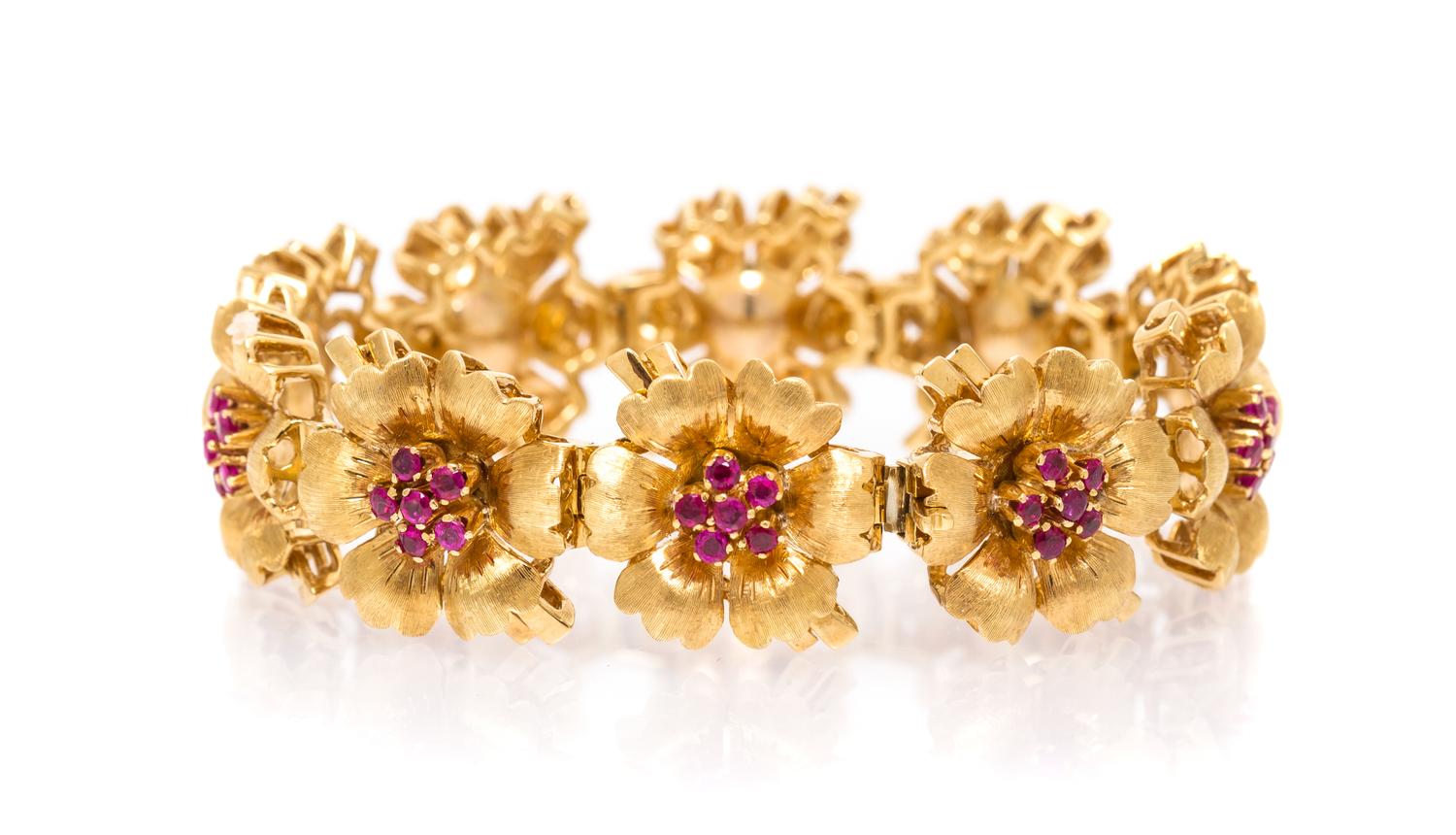An 18 Karat Yellow Gold and Ruby Flower Bracelet, Tiffany & Co., 31.90 dwts.