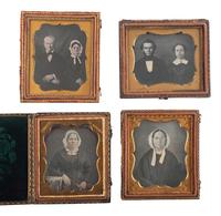 [EARLY PHOTOGRAPHY]. A group of 29 daguerreotypes featuring people with eyeglasses, including: