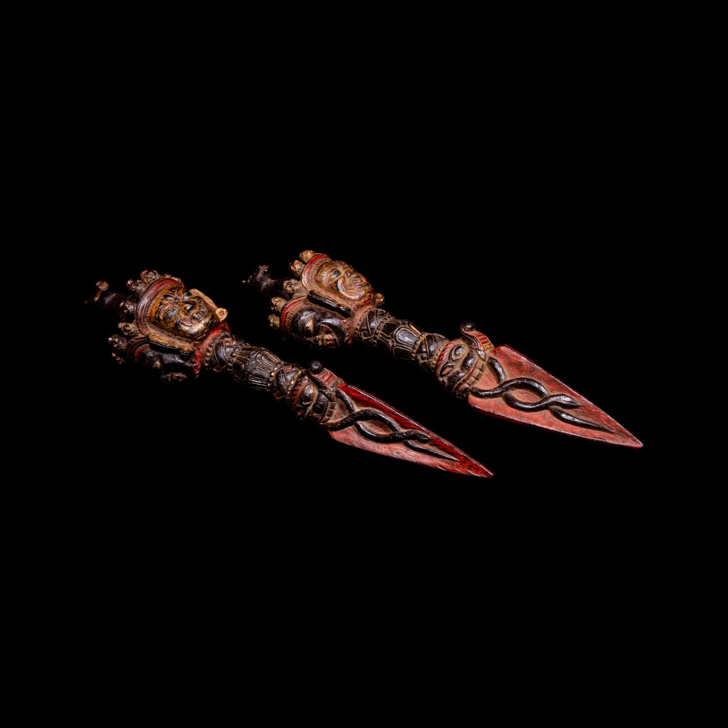 A Pair of Sino-Tibetan Gilt and Red Decorated Wood Vajries, Possibly Zitan, 18th-19th Century — 十八-十九世紀 藏傳彩繪紫檀普巴杵一對