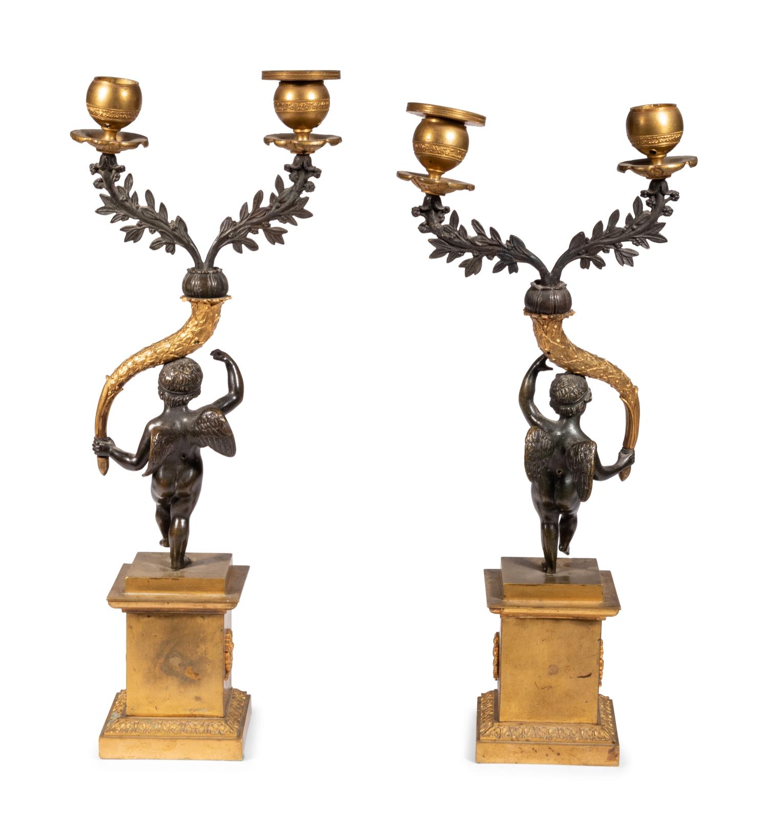 A Pair of Gilt and Patinated Bronze Figural Two-Light Candelabra