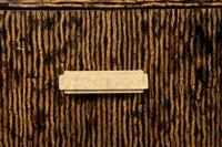 A Contemporary Palmwood-Veneered Chest of Drawers