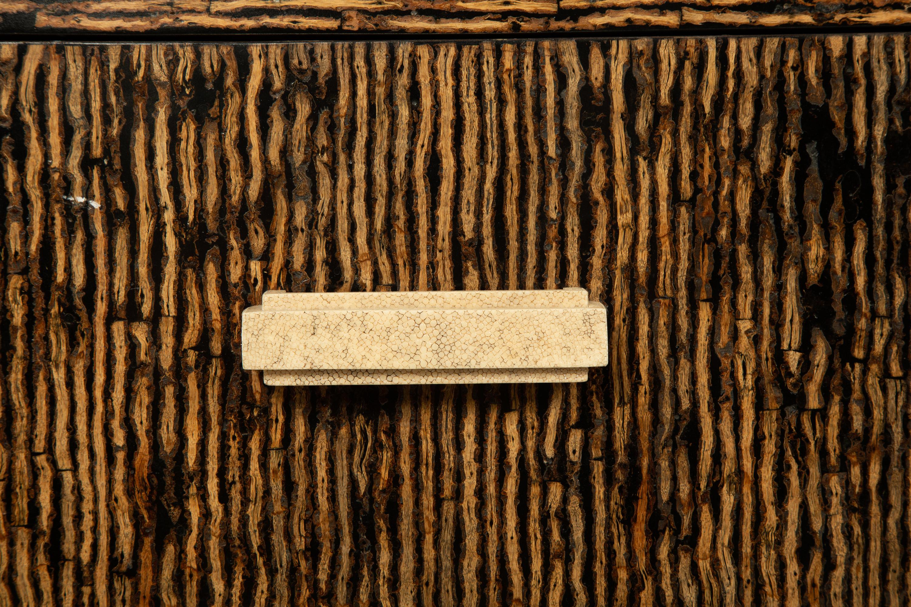 A Contemporary Palmwood-Veneered Chest of Drawers