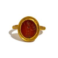 A Roman Gold and Carnelian Finger Ring with the Goddess Minerva Holding Nike