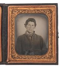 [CIVIL WAR]. Sixth plate ruby ambrotype of an armed cavalryman.