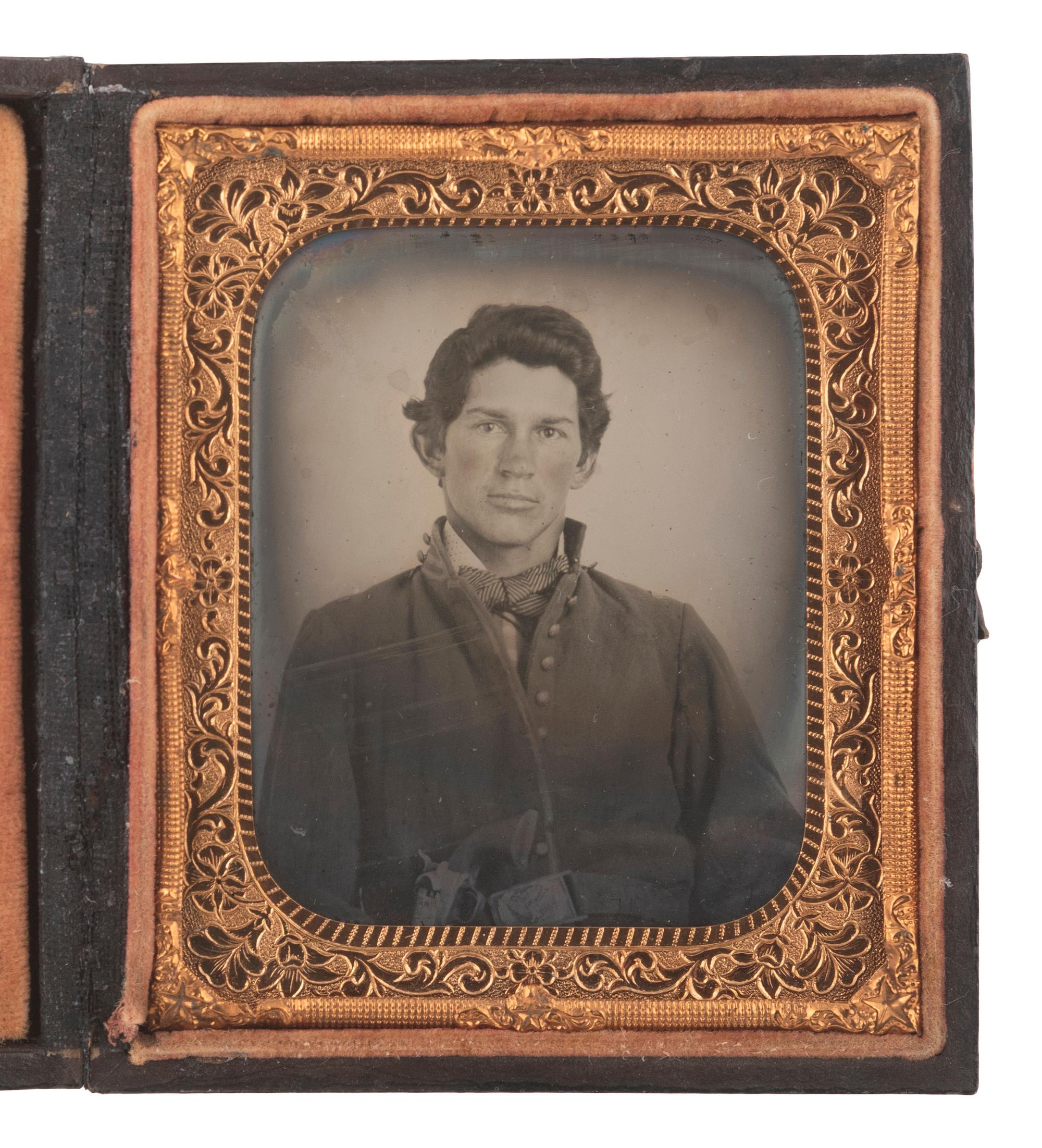 [CIVIL WAR]. Sixth plate ruby ambrotype of an armed cavalryman.