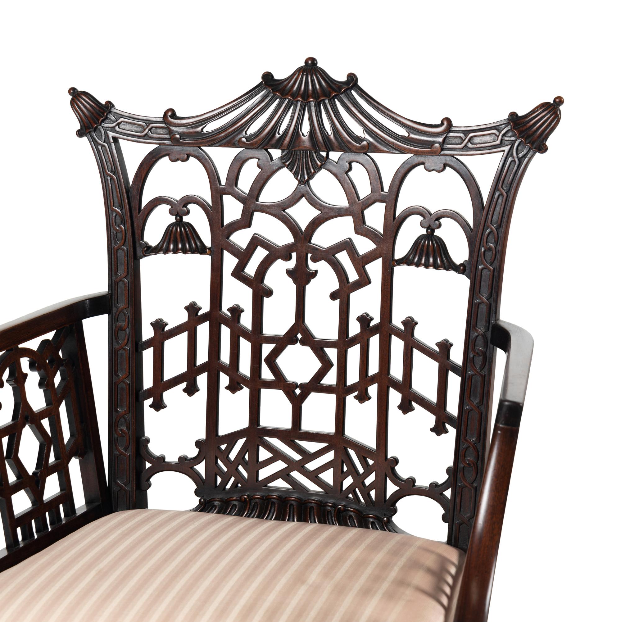 A Pair of George III Style Pierce-Carved Mahogany Armchairs