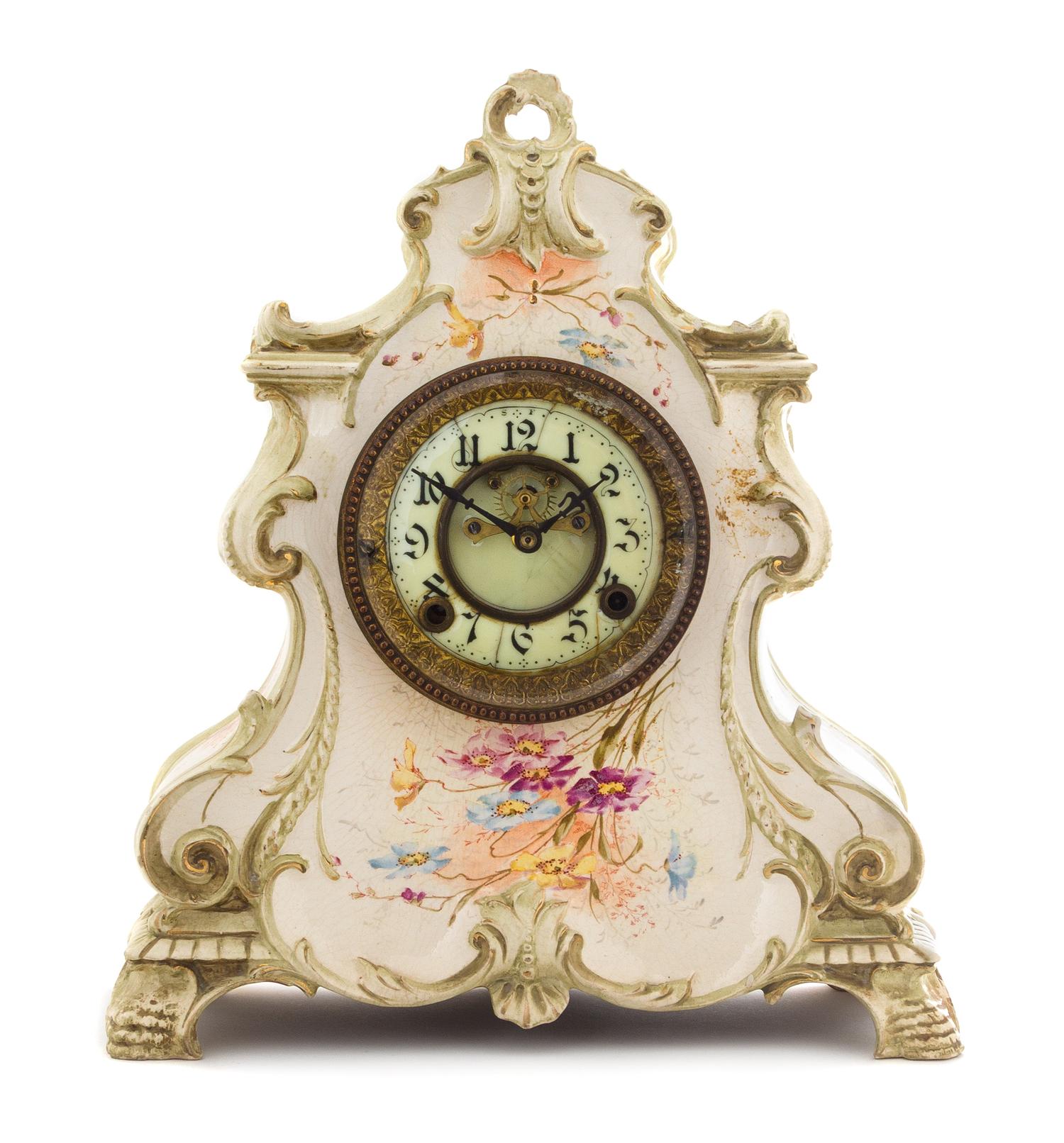 A Royal Bonn Style Porcelain Mantel Clock Height 14 1/2 inches.