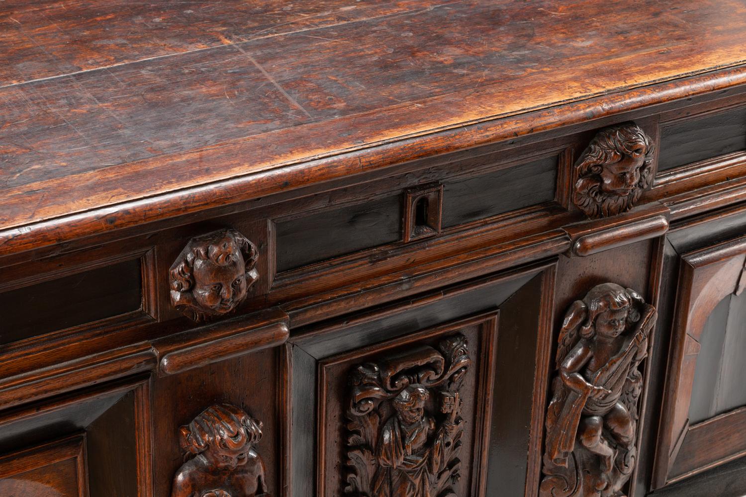An Italian Carved Oak and Walnut Cassone