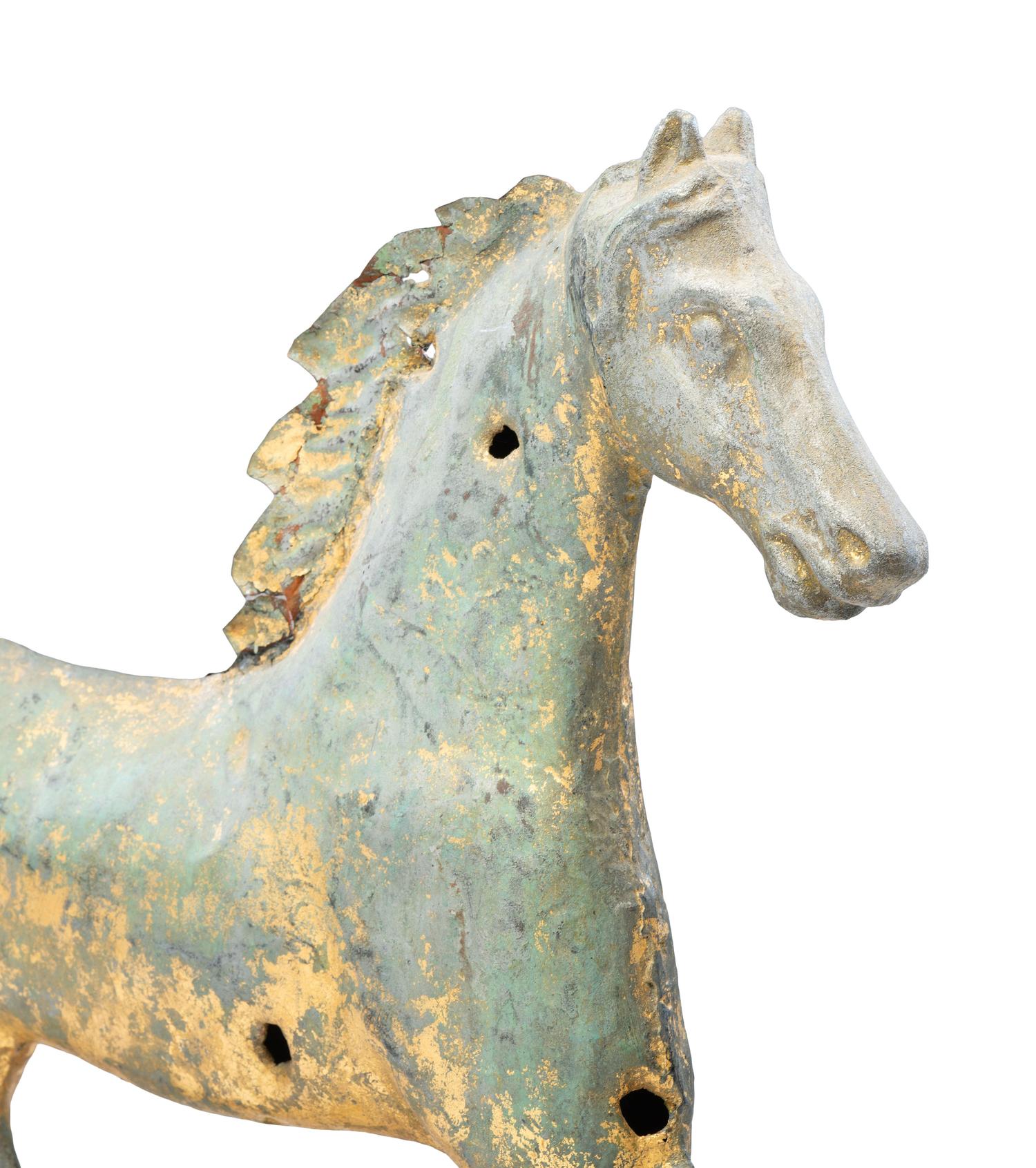 A Cast Zinc and Parcel Gilt Molded Copper Trotting Horse Weathervane